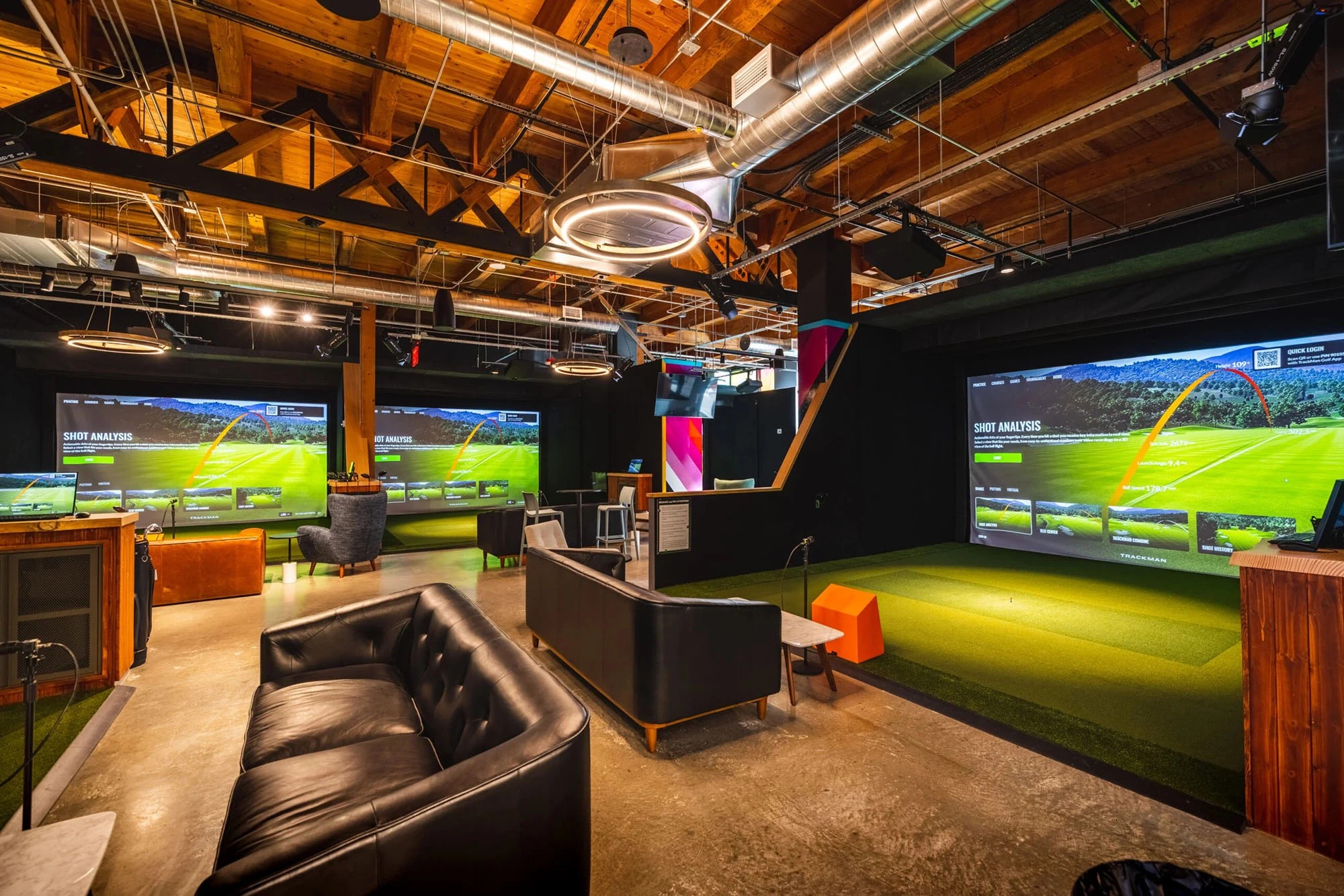 Close-up of golf simulator launch monitor and projector equipment